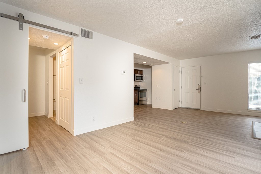 a bedroom and living room in an apartment